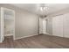 Spacious main bedroom with wood-style flooring and an en-suite bathroom at 14408 N 35Th Ave, Phoenix, AZ 85053