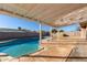 A covered patio overlooks the sparkling in-ground pool at 14408 N 35Th Ave, Phoenix, AZ 85053