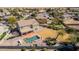 Aerial view of the backyard featuring a refreshing pool and well-maintained landscaping at 1481 E Lark St, Gilbert, AZ 85297