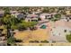 Overhead view of a backyard with a pool, patio area, and lush greenery at 1481 E Lark St, Gilbert, AZ 85297