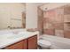 Bathroom featuring a bathtub, shower, toilet, vanity with a sink, and decorative tile at 1481 E Lark St, Gilbert, AZ 85297