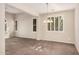 Bright dining room with plantation shutters, tile floors and modern chandelier at 1481 E Lark St, Gilbert, AZ 85297