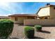 View of the exterior of the home featuring gravel landscaping and a mature landscape at 14851 N 25Th Dr # 11, Phoenix, AZ 85023