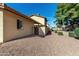 Exterior view of the home with rock landscaping and trimmed shrubs at 14851 N 25Th Dr # 11, Phoenix, AZ 85023