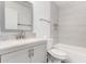 Modern bathroom vanity with gray cabinets, stone countertop, and tiled backsplash at 14851 N 25Th Dr # 11, Phoenix, AZ 85023