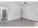 Spacious bedroom with tile floor, ceiling fan, and backyard access at 14851 N 25Th Dr # 11, Phoenix, AZ 85023