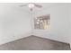 Bright bedroom features tile floors, ceiling fan, and window with blinds at 14851 N 25Th Dr # 11, Phoenix, AZ 85023