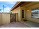 Cozy front patio of the residence with rock landscaping and a decorative entry door with a window at 14851 N 25Th Dr # 11, Phoenix, AZ 85023