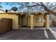 Inviting home exterior featuring a gravel yard, a covered entryway, and a security door at 14851 N 25Th Dr # 11, Phoenix, AZ 85023