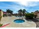 Community hot tub and pool area with lounge chairs and tables, perfect for relaxation at 14851 N 25Th Dr # 11, Phoenix, AZ 85023