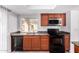 Kitchen featuring granite countertops, stainless steel microwave, and a stainless steel sink at 14851 N 25Th Dr # 11, Phoenix, AZ 85023