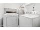 Laundry room with washer, dryer, and water heater at 14851 N 25Th Dr # 11, Phoenix, AZ 85023