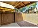 A private outdoor space featuring a gravel ground cover and a wood fence at 14851 N 25Th Dr # 11, Phoenix, AZ 85023