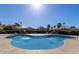 Relaxing community pool with lounge seating under shade, surrounded by mature landscaping at 14851 N 25Th Dr # 11, Phoenix, AZ 85023