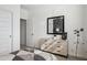 Secondary bedroom with a space themed mirror and dresser with light wood finish at 1503 S 239Th Dr, Buckeye, AZ 85326