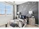 Eclectic bedroom with fun space-themed chalkboard wall and playful decor at 1503 S 239Th Dr, Buckeye, AZ 85326