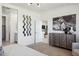 This secondary bedroom has neutral walls, carpet flooring, with natural light and modern decor at 1503 S 239Th Dr, Buckeye, AZ 85326