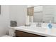 Clean bathroom featuring a white sink, chrome faucet, and neutral accents at 1531 S 239Th Dr, Buckeye, AZ 85326