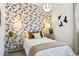 This bedroom includes a fun owl-themed wall, pendant light, and twin white nightstands at 1531 S 239Th Dr, Buckeye, AZ 85326