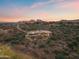 Expansive aerial view of a luxurious home with a pool and desert landscape at 15504 E Firerock Country Club Dr, Fountain Hills, AZ 85268