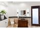 Bathroom boasts a glass vessel sink, backlit mirror, and rustic wood cabinet at 15504 E Firerock Country Club Dr, Fountain Hills, AZ 85268