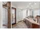 Bathroom with a double sink vanity, walk-in shower, and a door to the outside with wood blinds at 15504 E Firerock Country Club Dr, Fountain Hills, AZ 85268