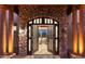 Grand entrance featuring a stone archway and double doors leading into a bright, inviting living space at 15504 E Firerock Country Club Dr, Fountain Hills, AZ 85268