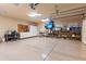 Spacious three-car garage equipped with ample storage cabinets, work space, and epoxy floors at 15504 E Firerock Country Club Dr, Fountain Hills, AZ 85268