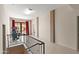 Bright hallway with neutral walls, dark red curtains, and exercise machine at 15504 E Firerock Country Club Dr, Fountain Hills, AZ 85268