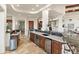 This kitchen features stone countertops, stainless appliances, and custom cabinetry at 15504 E Firerock Country Club Dr, Fountain Hills, AZ 85268