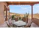 Charming outdoor patio with comfortable seating, views, and a pergola covered ceiling at 15504 E Firerock Country Club Dr, Fountain Hills, AZ 85268