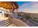 Cozy outdoor patio with a pergola-covered ceiling and views of the desert landscape at 15504 E Firerock Country Club Dr, Fountain Hills, AZ 85268