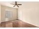 Bedroom with ceiling fan and wood floors at 15602 N 19Th St, Phoenix, AZ 85022