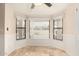 Breakfast nook featuring a bay window with vertical blinds and neutral tile floors at 15602 N 19Th St, Phoenix, AZ 85022