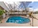 Backyard swimming pool surrounded by desert landscaping at 15602 N 19Th St, Phoenix, AZ 85022