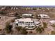 Desert home featuring a swimming pool, patio, and lush, mature landscaping at 15747 E Greystone Dr, Fountain Hills, AZ 85268