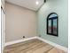 Unique bedroom featuring two-tone walls and an arched window with mountain views at 15747 E Greystone Dr, Fountain Hills, AZ 85268