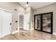 Cozy bedroom featuring a private doorway and large glass door that leads outside at 15747 E Greystone Dr, Fountain Hills, AZ 85268