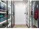 Walk-in closet features custom shelving and glass doors at 15747 E Greystone Dr, Fountain Hills, AZ 85268