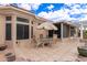 Charming backyard with a patio set on tile and low-maintenance landscaping at 16019 W Heritage Dr, Sun City West, AZ 85375
