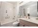Bright bathroom with neutral tones, tub-shower combo, and modern vanity at 16019 W Heritage Dr, Sun City West, AZ 85375