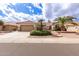 Inviting single-story home with desert landscaping, a tiled roof, and a spacious two-car garage at 16019 W Heritage Dr, Sun City West, AZ 85375