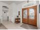 Bright foyer with tile flooring, a decorative glass door, and a view into the home at 16019 W Heritage Dr, Sun City West, AZ 85375