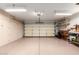 Spacious garage with ample storage, workbench, and overhead lighting at 16019 W Heritage Dr, Sun City West, AZ 85375