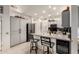 Well-lit kitchen featuring a stainless steel refrigerator, gray cabinets, and a wine cooler at 16019 W Heritage Dr, Sun City West, AZ 85375