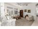 Comfortable living room featuring a large window, plush seating, and neutral decor at 16019 W Heritage Dr, Sun City West, AZ 85375