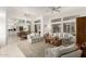 Open concept living room with large windows and plenty of natural light at 16019 W Heritage Dr, Sun City West, AZ 85375