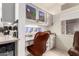 Small, bright office space with custom cabinets and a leather chair at 16019 W Heritage Dr, Sun City West, AZ 85375