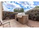 Built-in outdoor kitchen area with BBQ grill, ideal for outdoor cooking at 16019 W Heritage Dr, Sun City West, AZ 85375