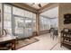 Inviting sunroom with ample natural light, neutral tones and comfortable seating perfect for relaxation and entertaining at 16019 W Heritage Dr, Sun City West, AZ 85375